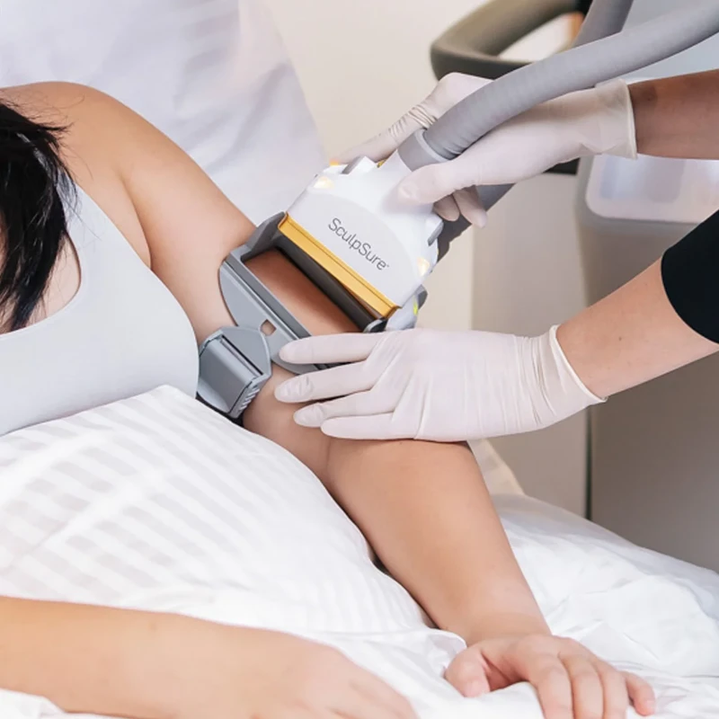 Woman undergoing SculpSure treatment on the arm at Soluna Medical in Las Vegas