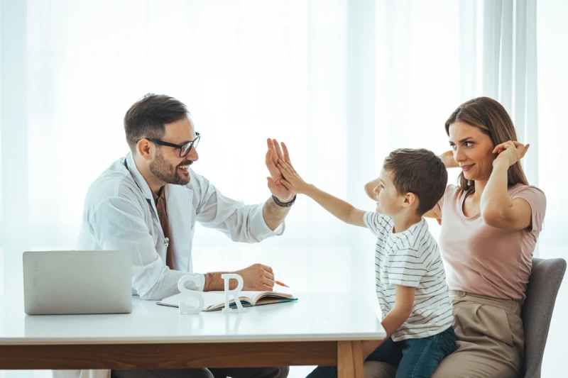 doctor interacting on child with his mother at Soluna Medical
